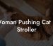 Woman Pushing Cat In Stroller